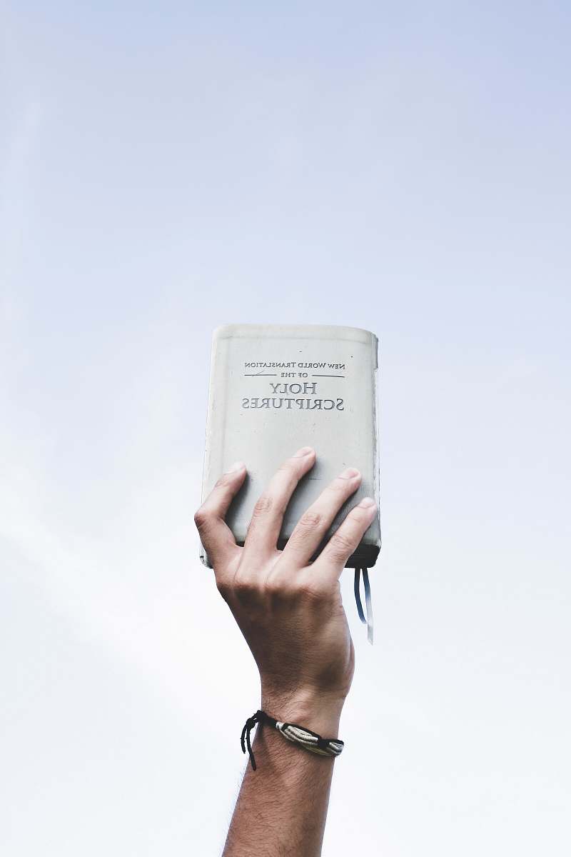 people person holding bible bible