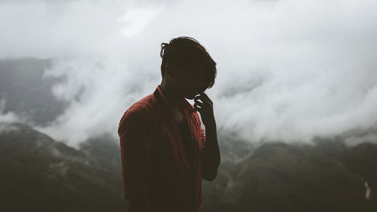 people person standing in front of green mountains during daytime human
