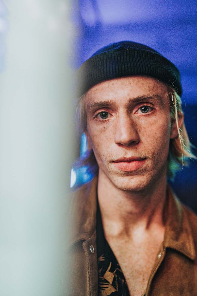 people shallow focus photography of man in hat and leather jacket human