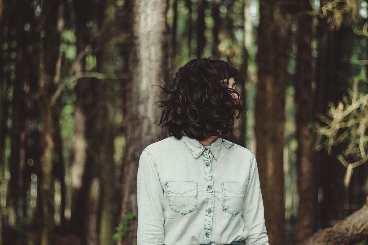 people woman in white denim dress shirt taking a photo human