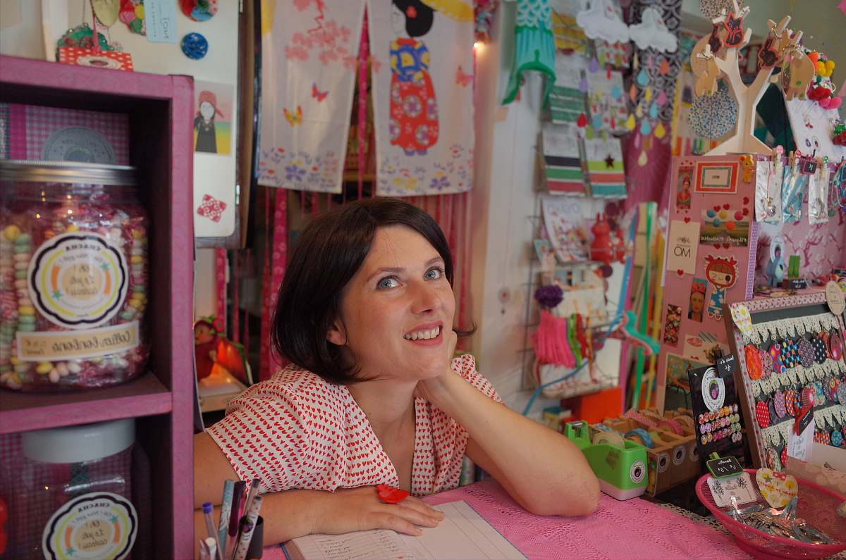 people woman leaning on pink desk human