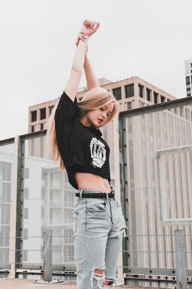 people woman stretching her arm upward human