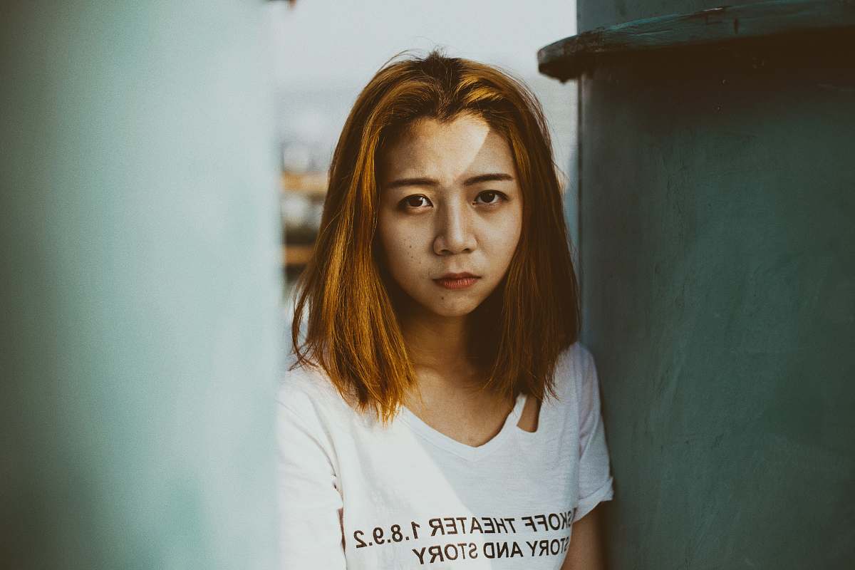 people woman wearing white top near metal case human