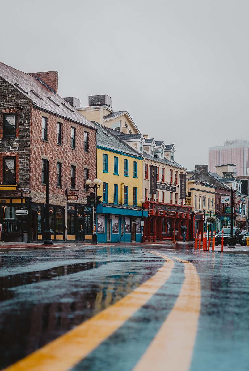  road beside buildings during daytime 