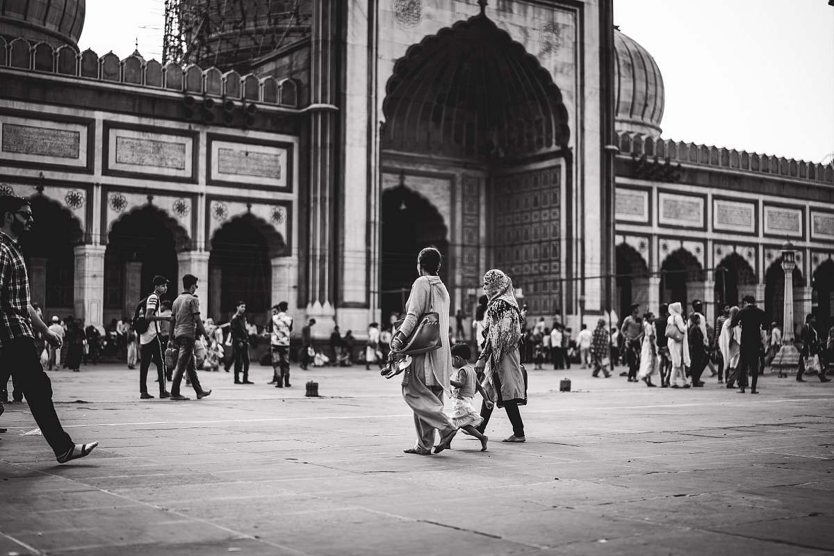 building grayscale photography of people city