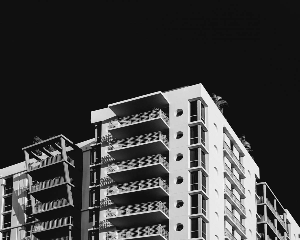 building white tall building grey-scale photography city