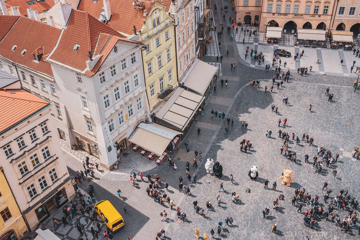 city aerial photography of crowd of people in a plaza downtown