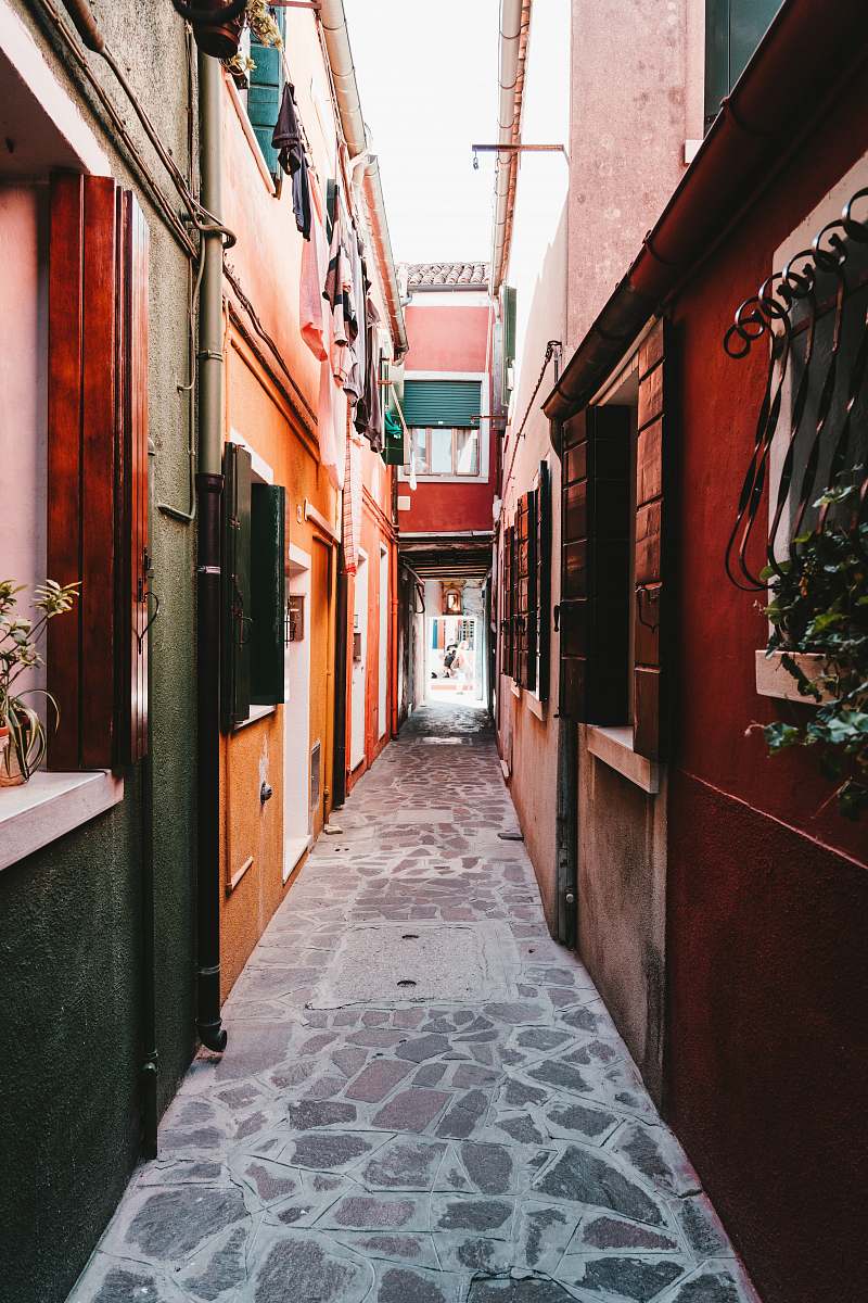 city alley photography of walkway during daytime road