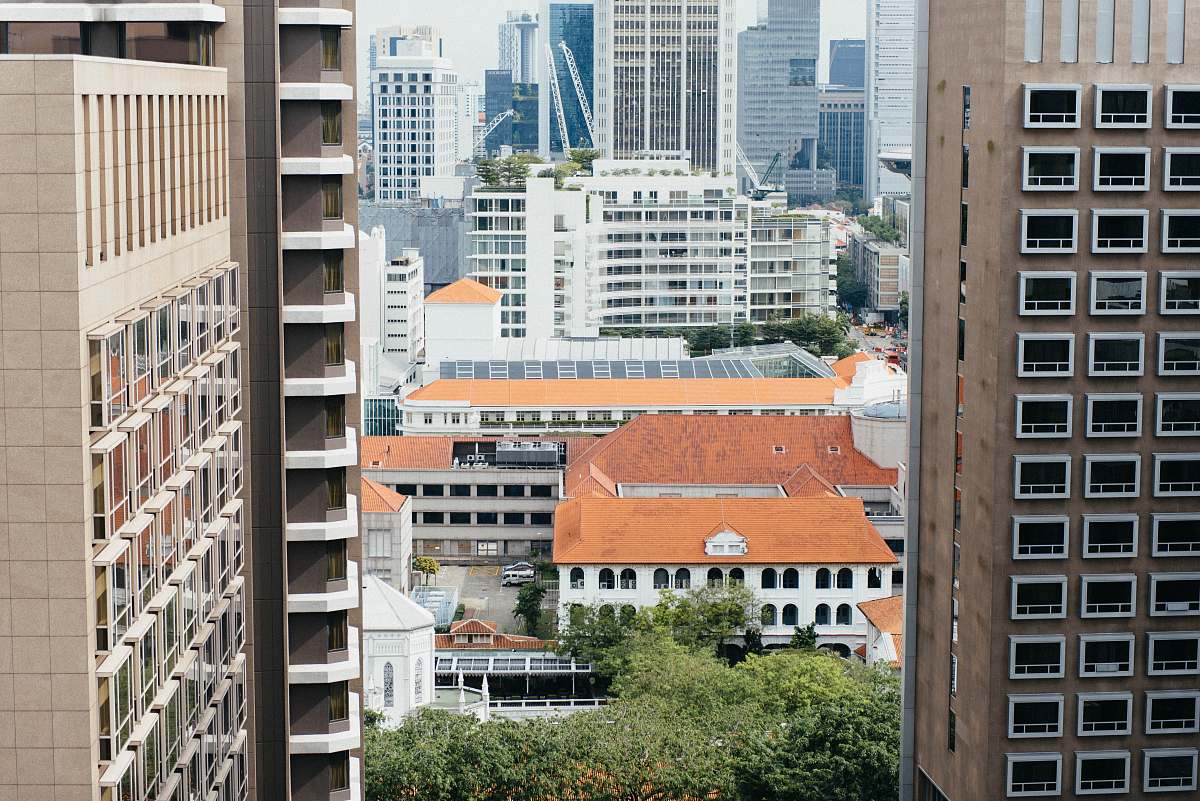 city architectural photography of brown building high rise