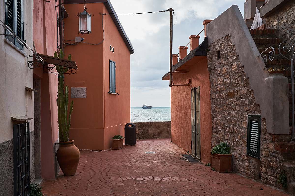 city architectural photography of houses near coast alley