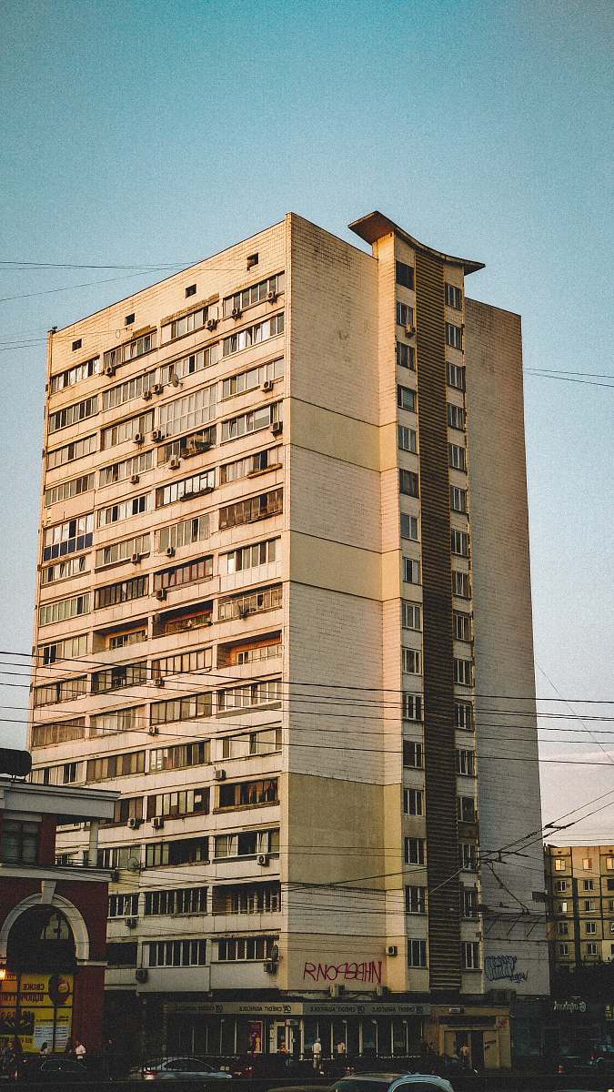 city beige concrete building during daytime high rise