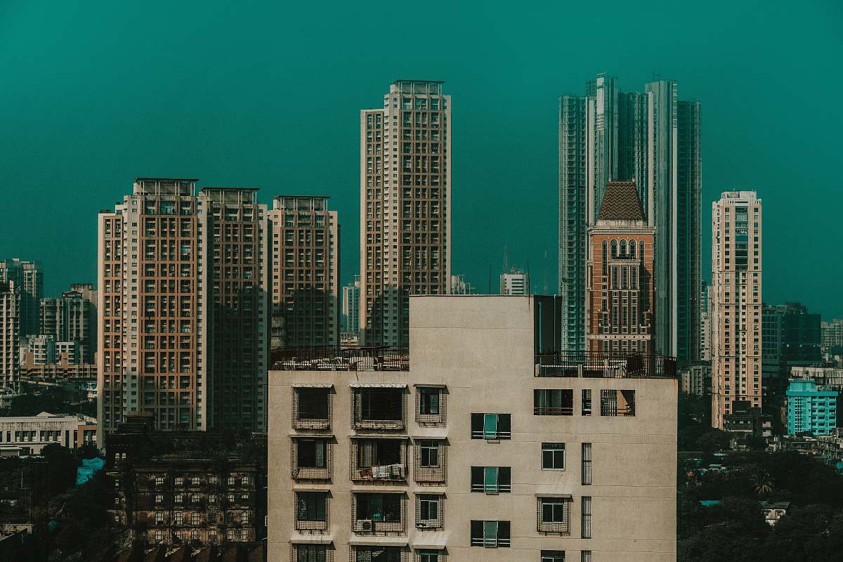 city beige concrete buildings during daytime high rise