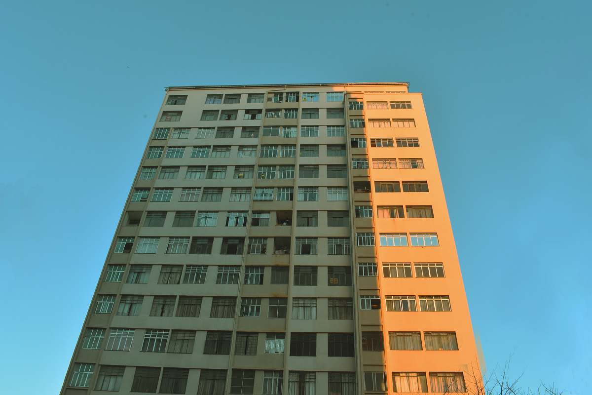 city beige concrete high-rise building high rise