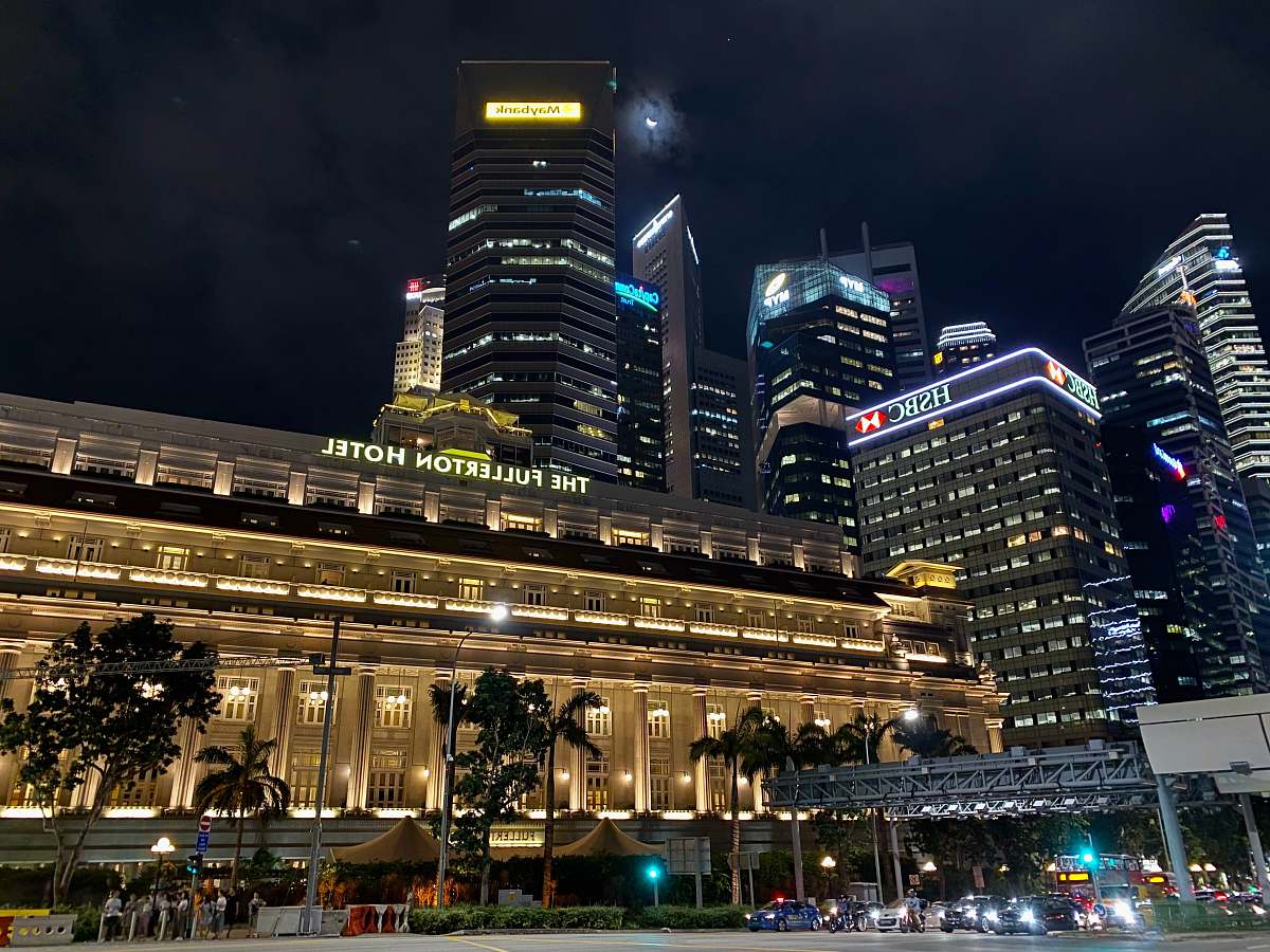 city beige high-rise building during night time downtown