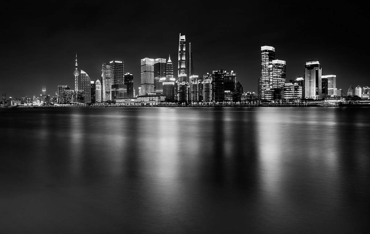 city black and white photo of high rise building black-and-white