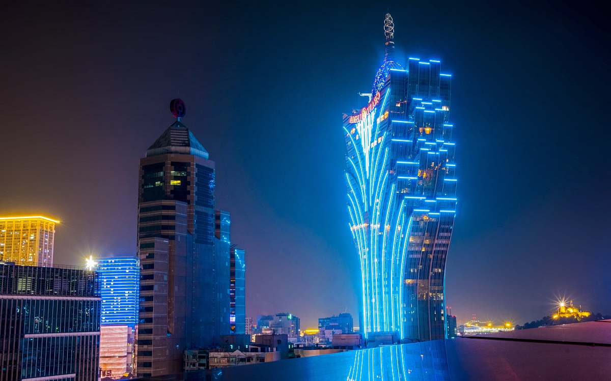 city blue and black lit high-rise building metropolis