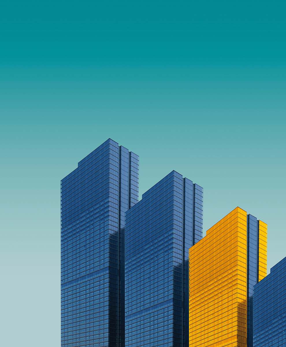 city blue and yellow curtain wall building during daytime office building