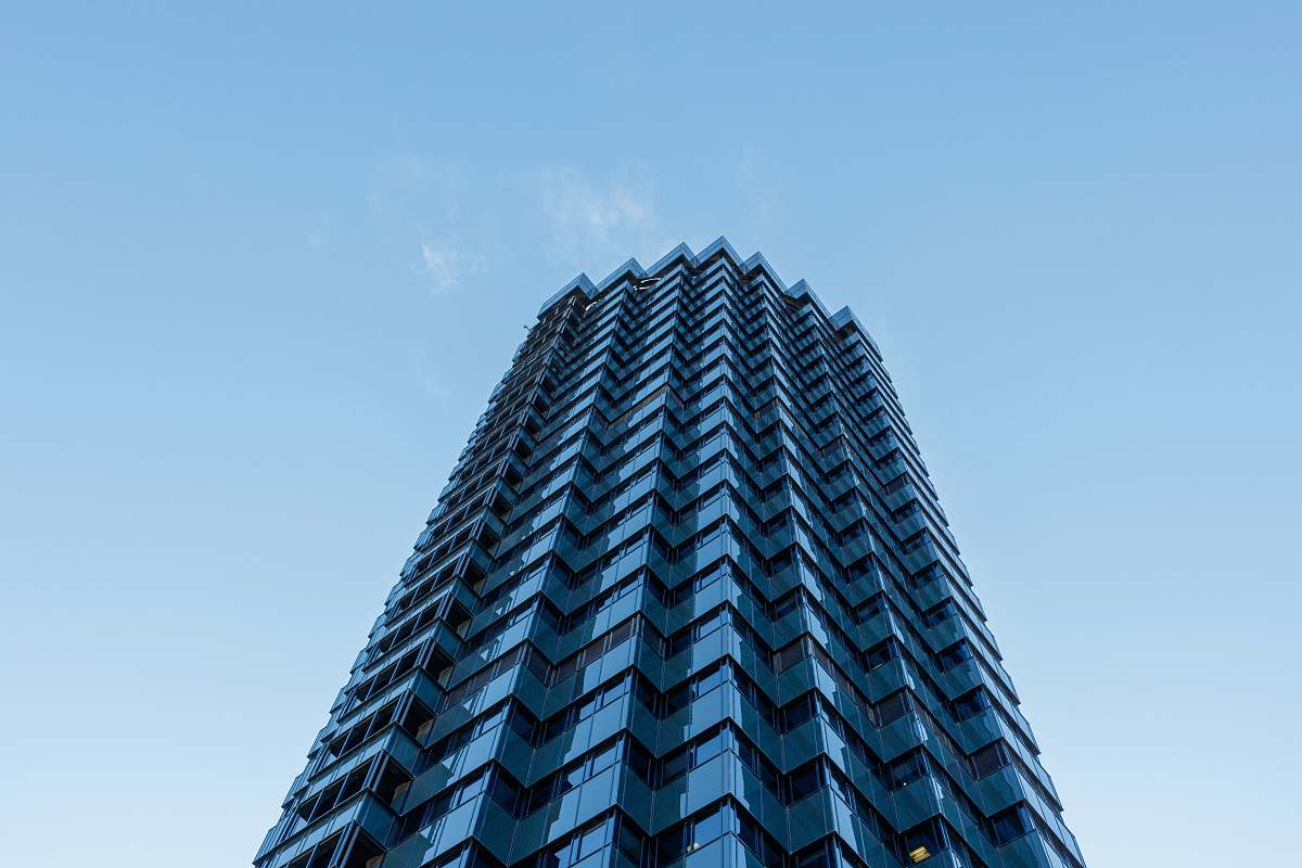 city blue building worms-eye view high rise