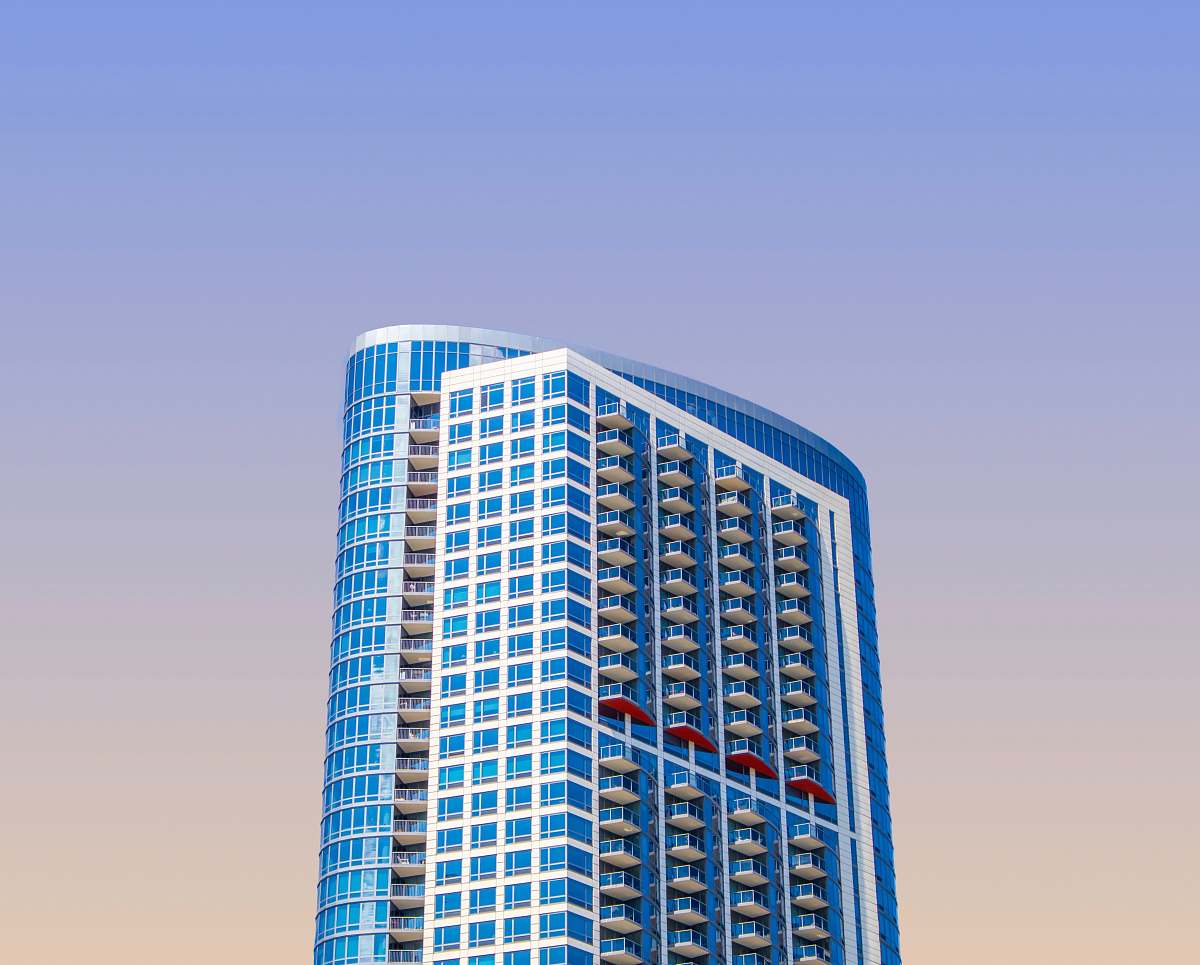 condo blue high-rise building during daytime housing