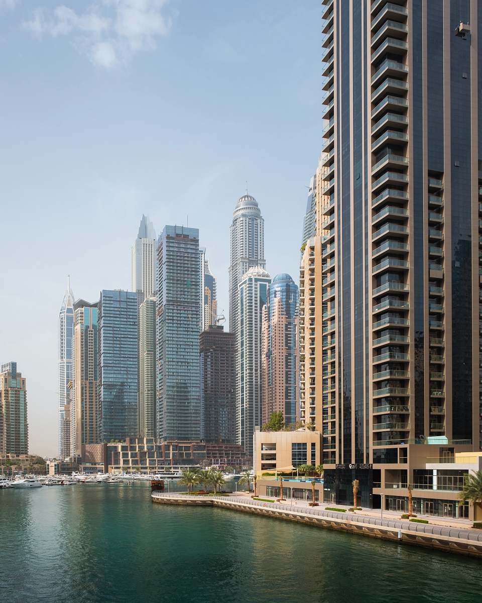 city body of water beside high-rise buildings urban