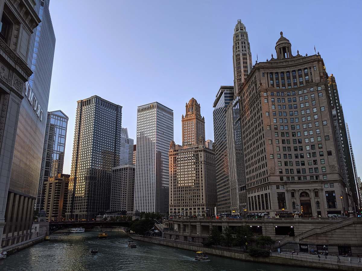 city body of water between buildings at daytime metropolis