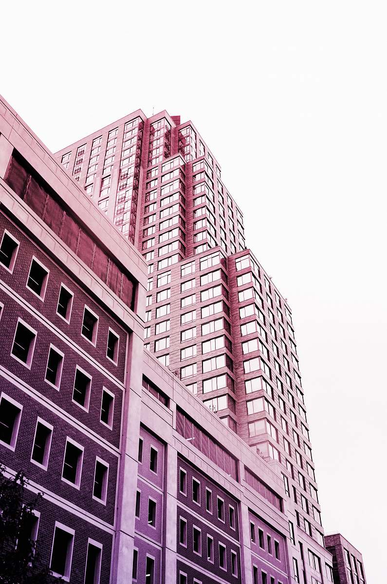 city brown and beige building under white sky high rise