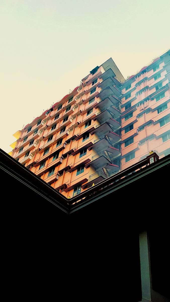 city brown building during daytime high rise