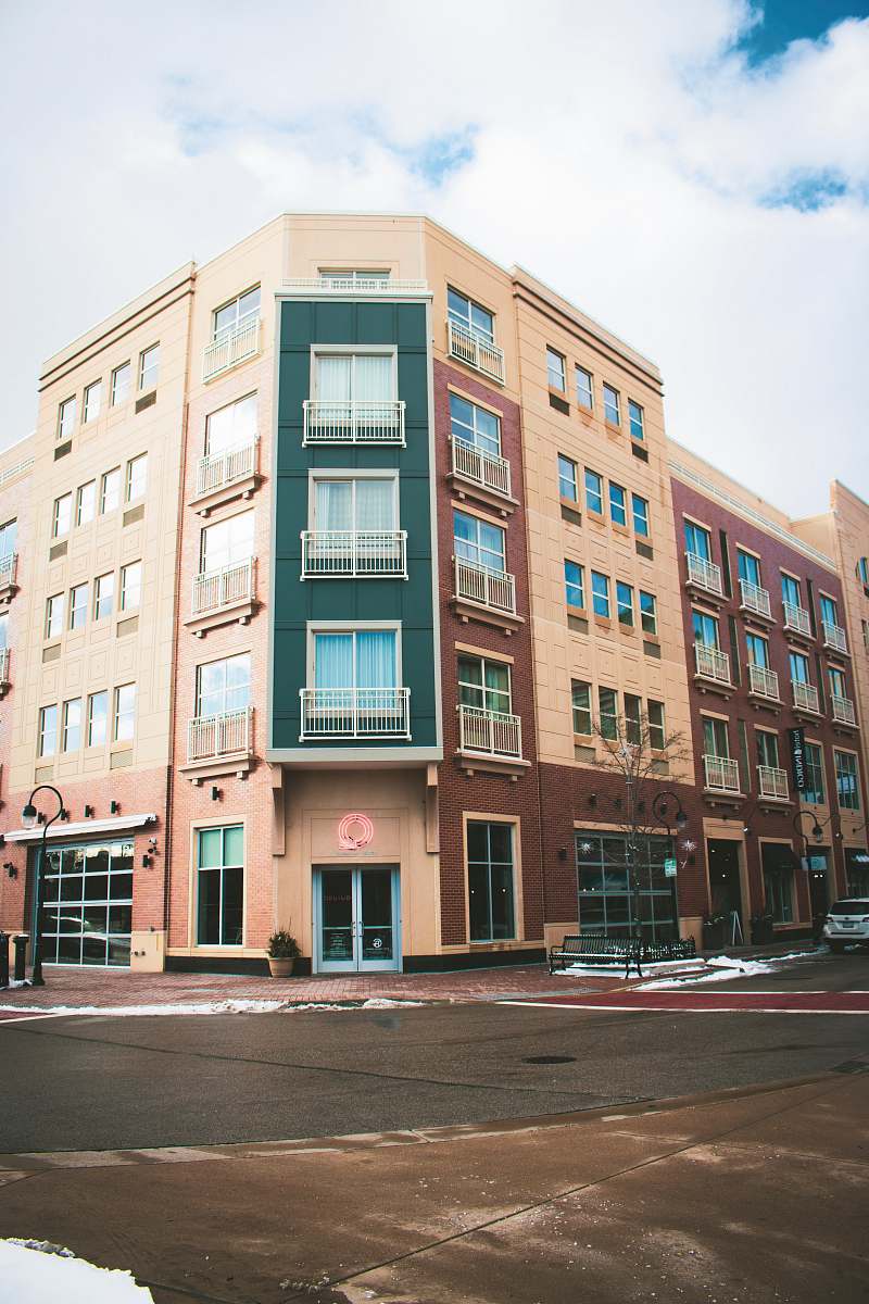 city brown building near road high rise