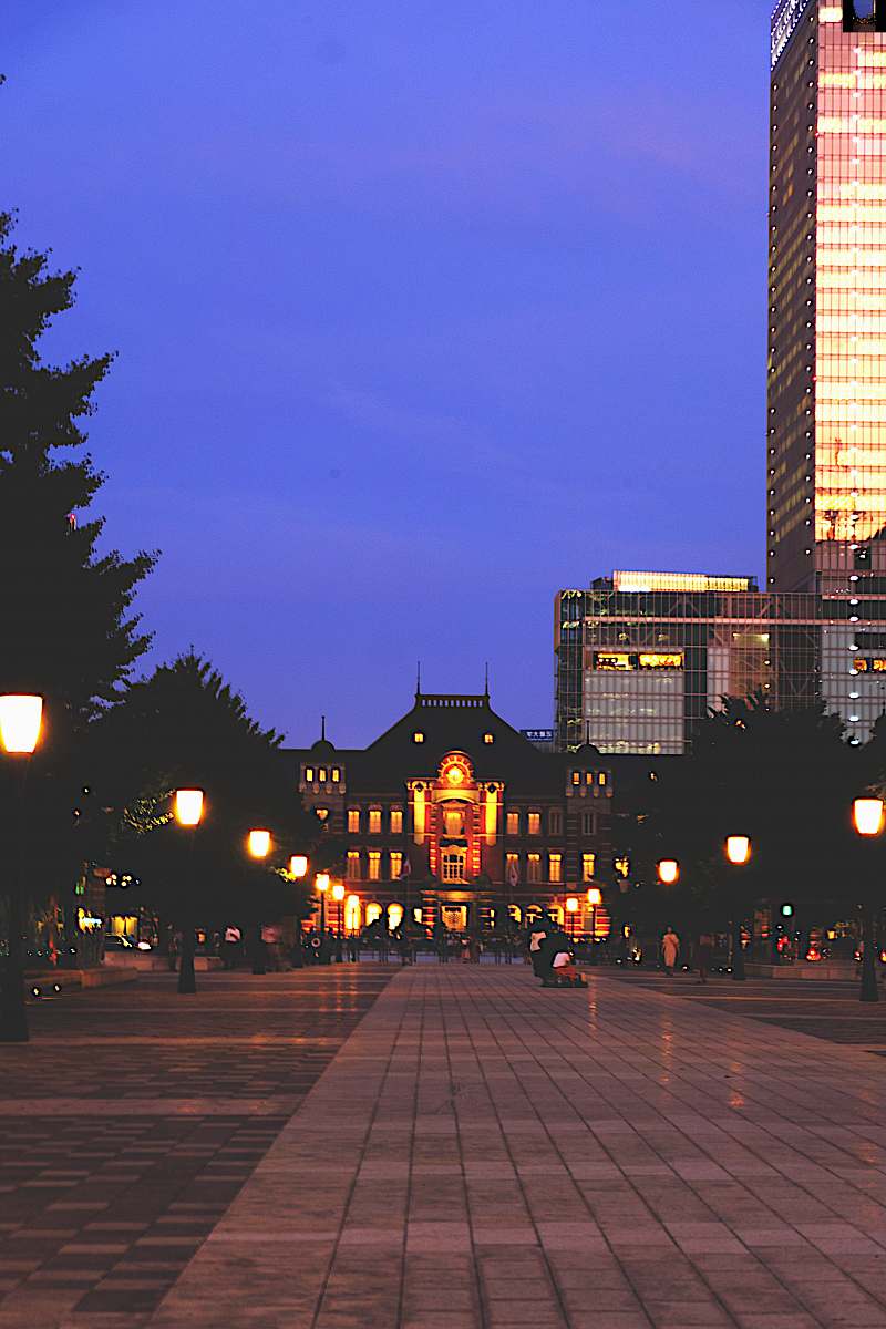 city brown buildings at night downtown