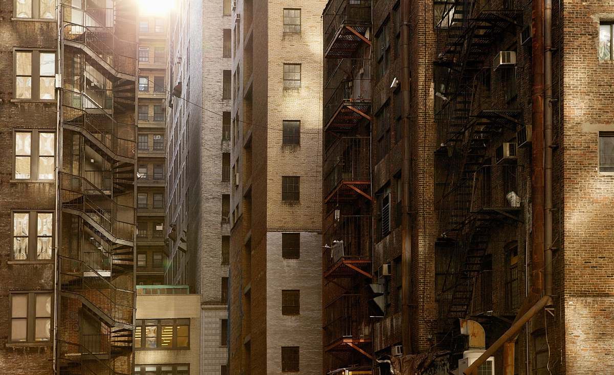 city brown buildings under sunny sky windows