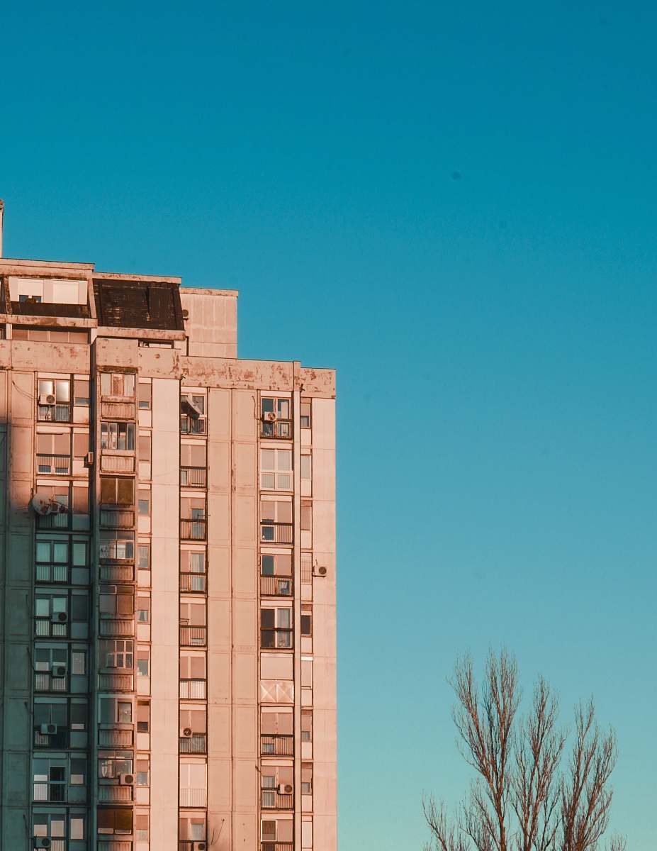 city brown concrete high-rise building high rise
