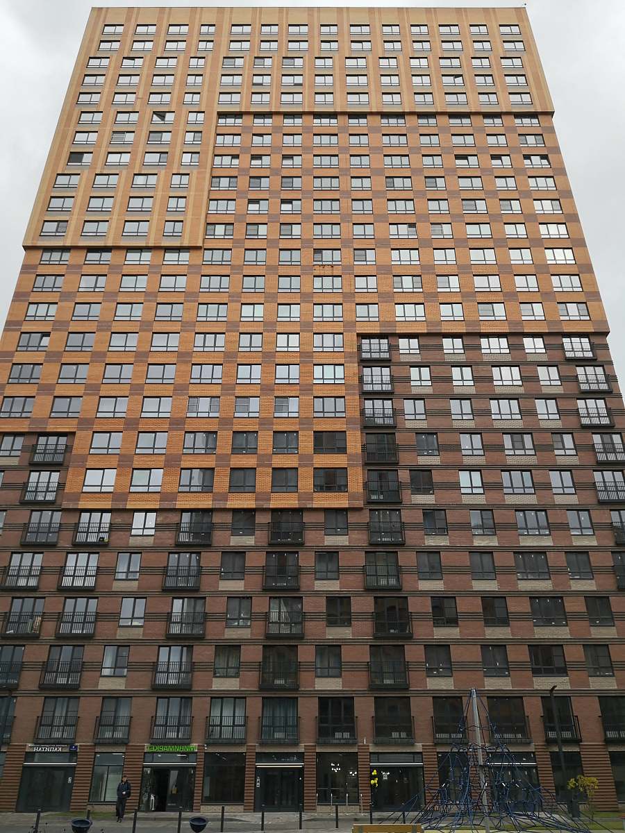 city brown high rise building high rise