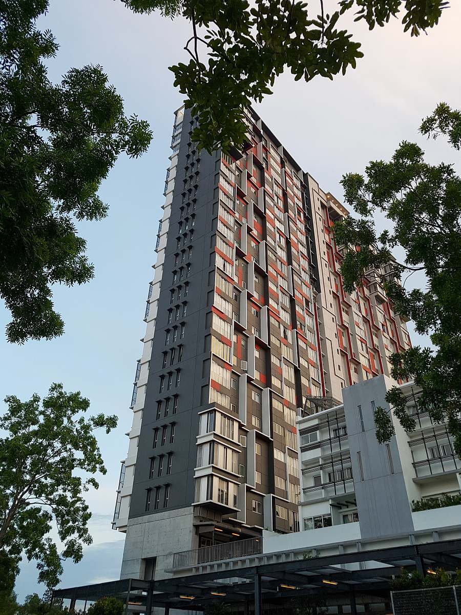 city brown high-rise building under blue sky high rise
