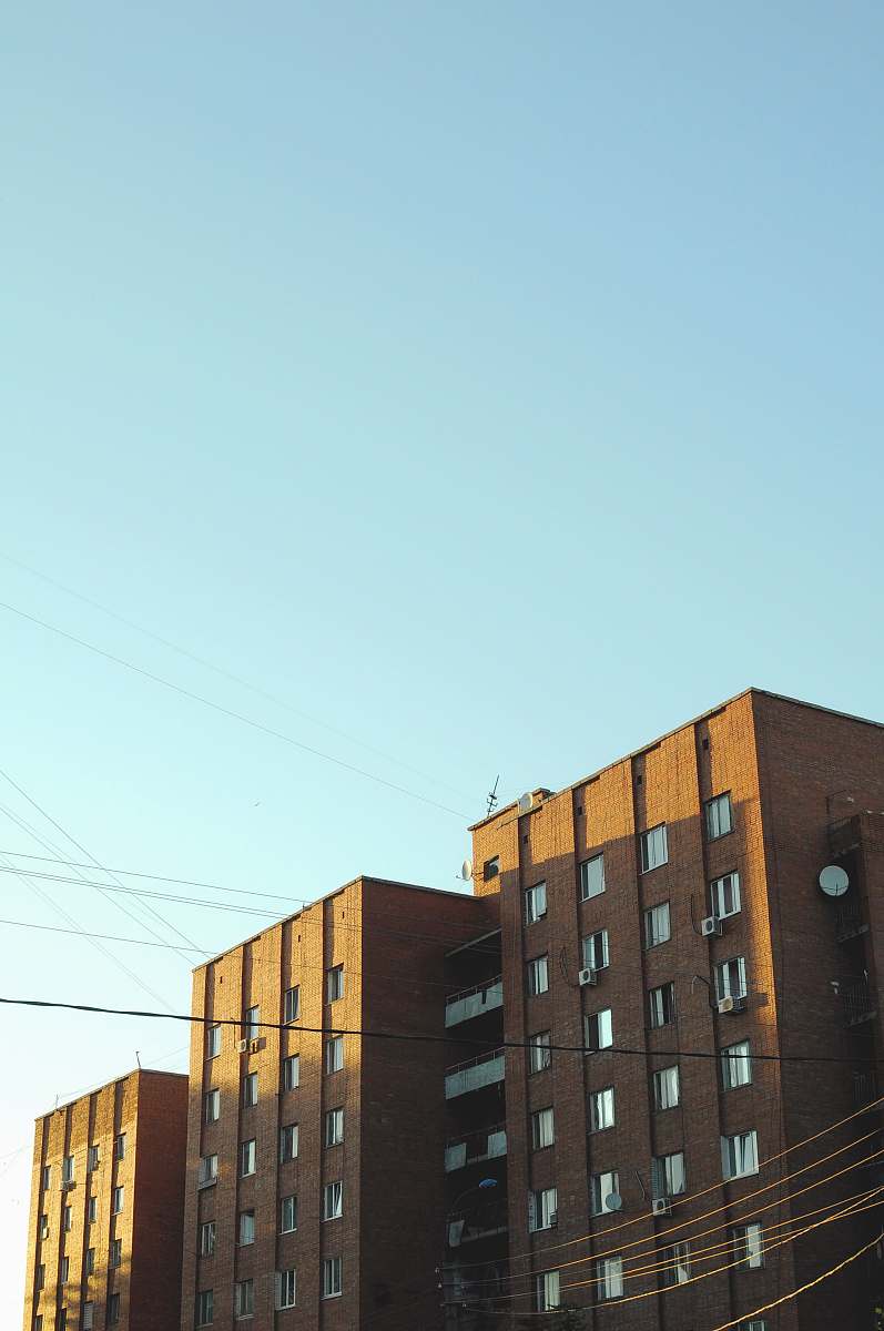 city brown painted building high rise