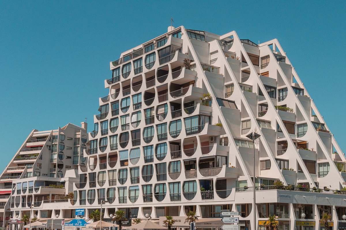 city building facade under blue sky high rise