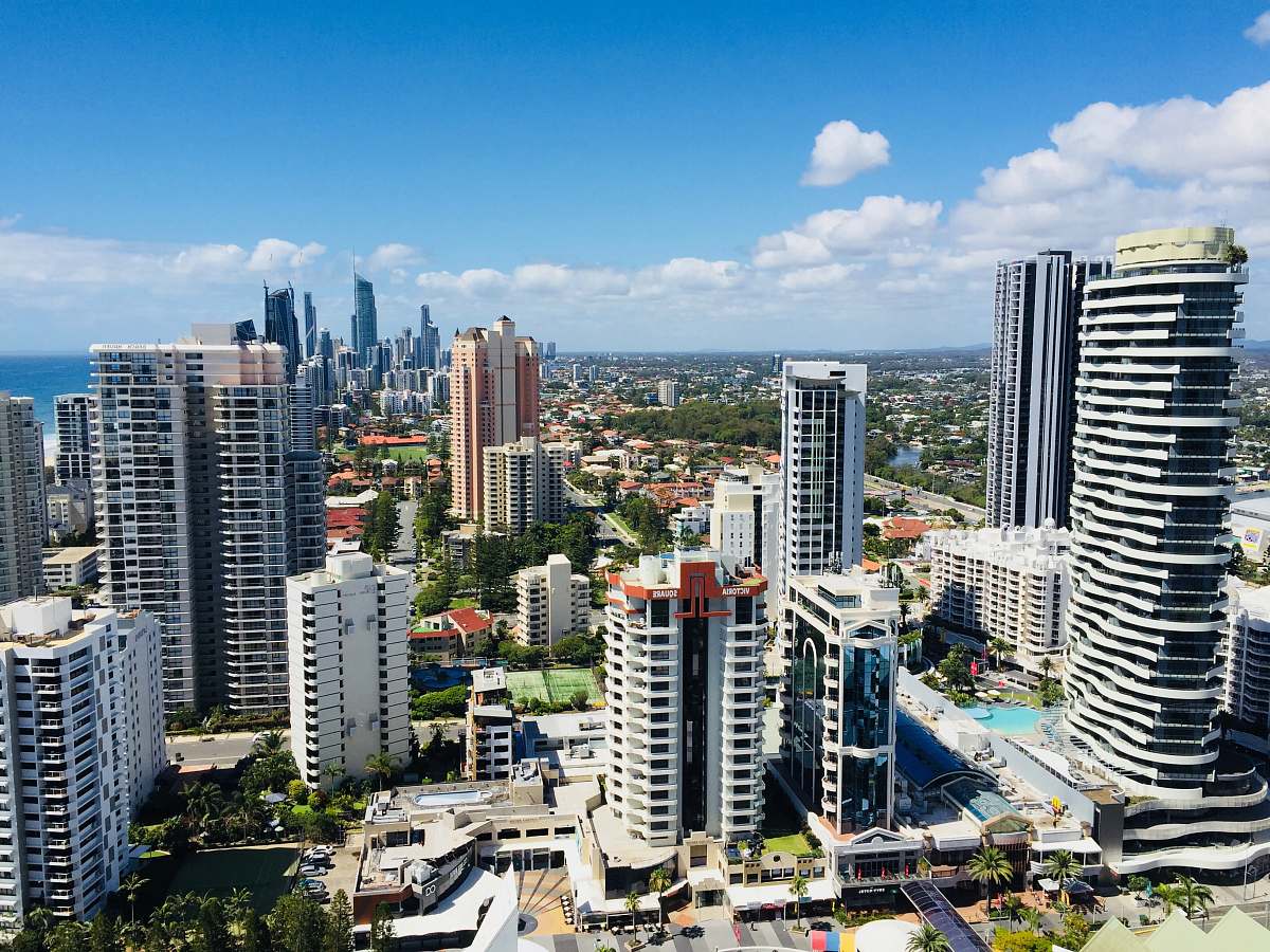 city building under blue sky during daytime town