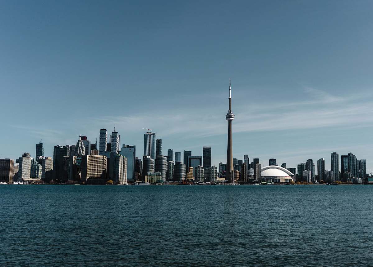 city buildings beside ocean high rise