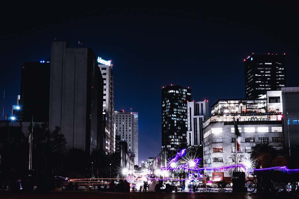 city buildings during night time downtown