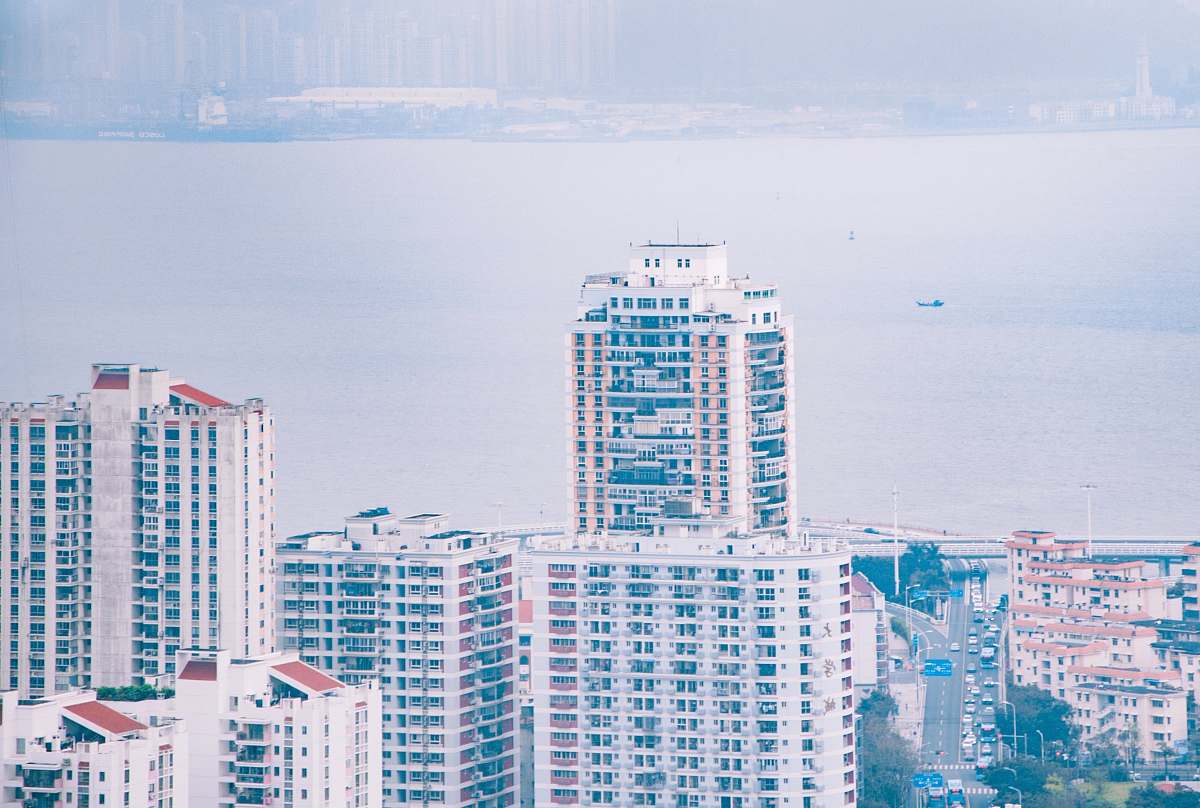 city buildings near shore high rise