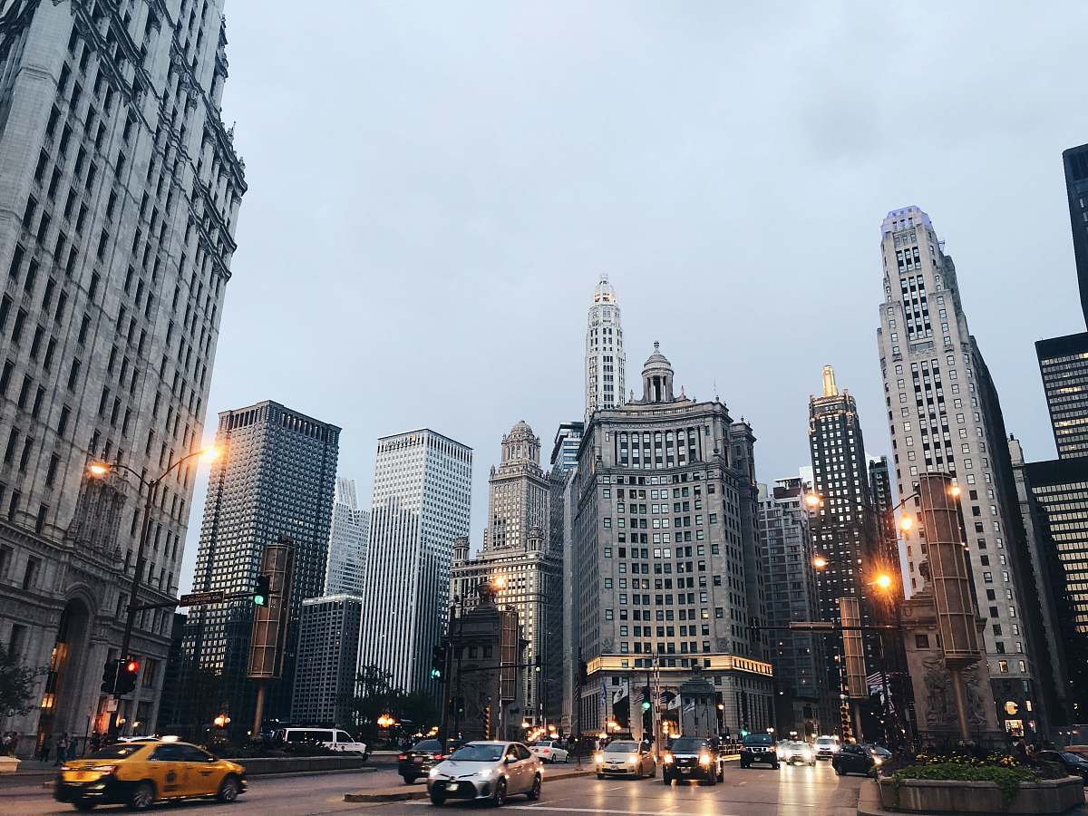 city car running on road downtown