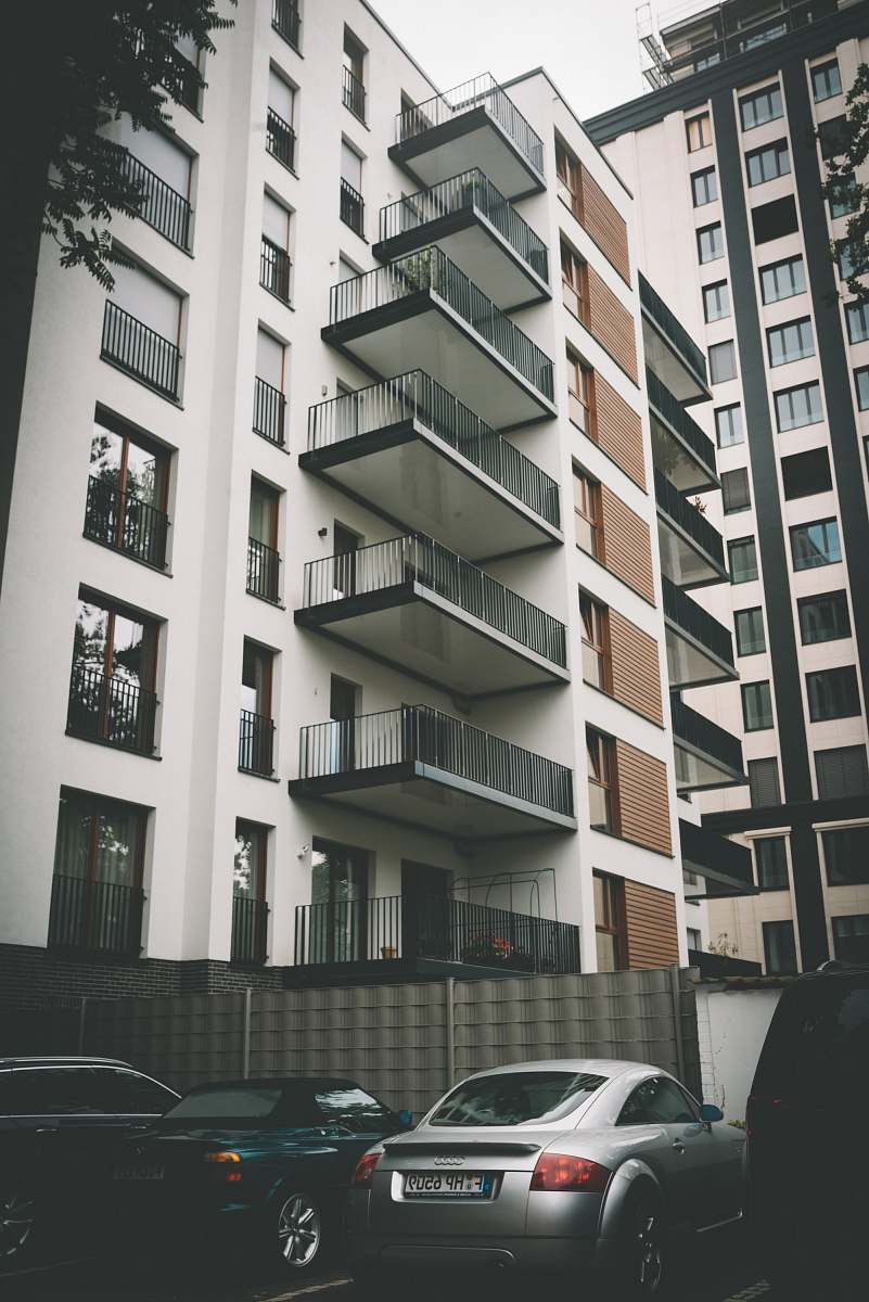city cars parked beside building urban