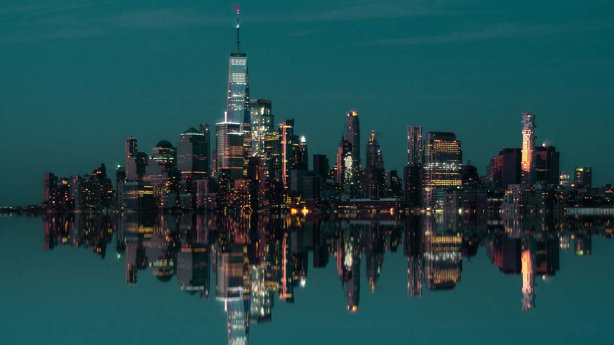 city city buildings near body of water urban
