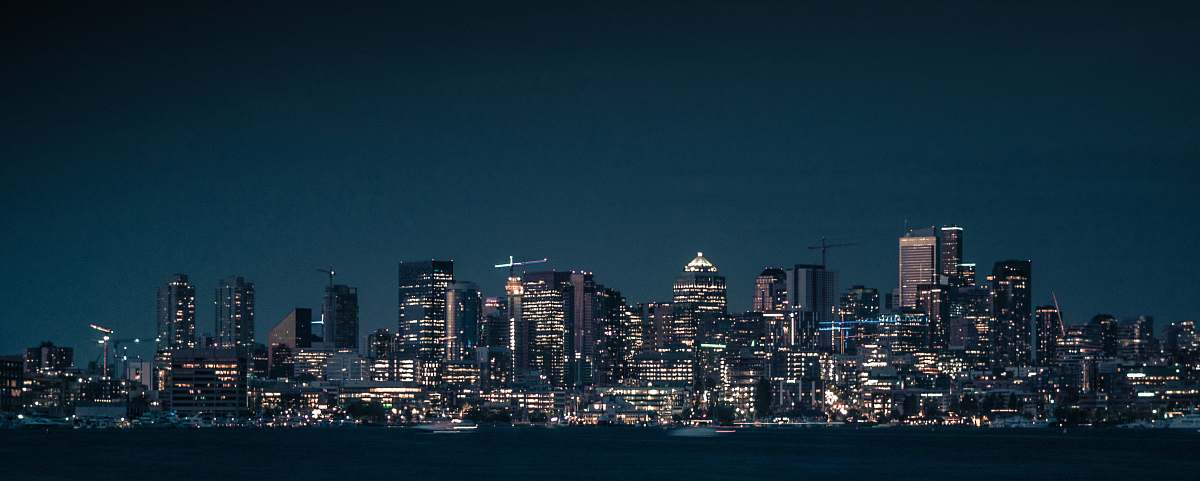 city city near body of water during nighttime grey