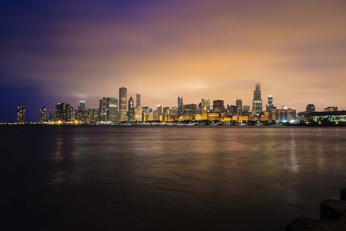 city city skyline near body of water during golden hour chicago