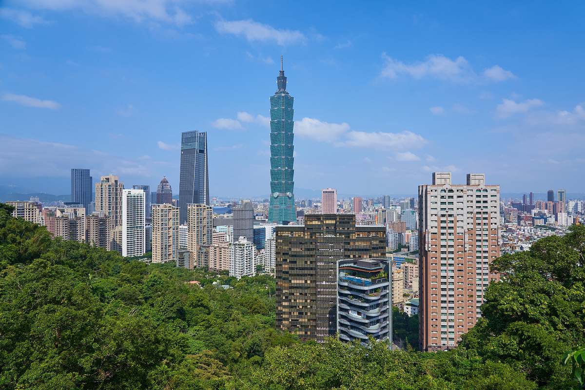 city city with high-rise buildings under blue and white sky during daytime town
