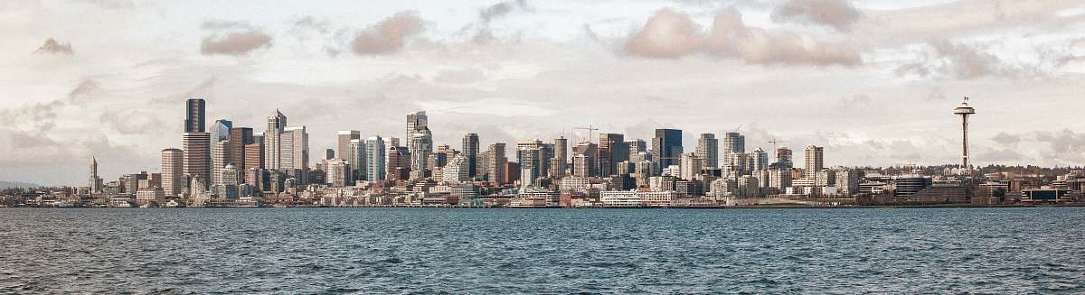 city cityscape near body of water during daytime town