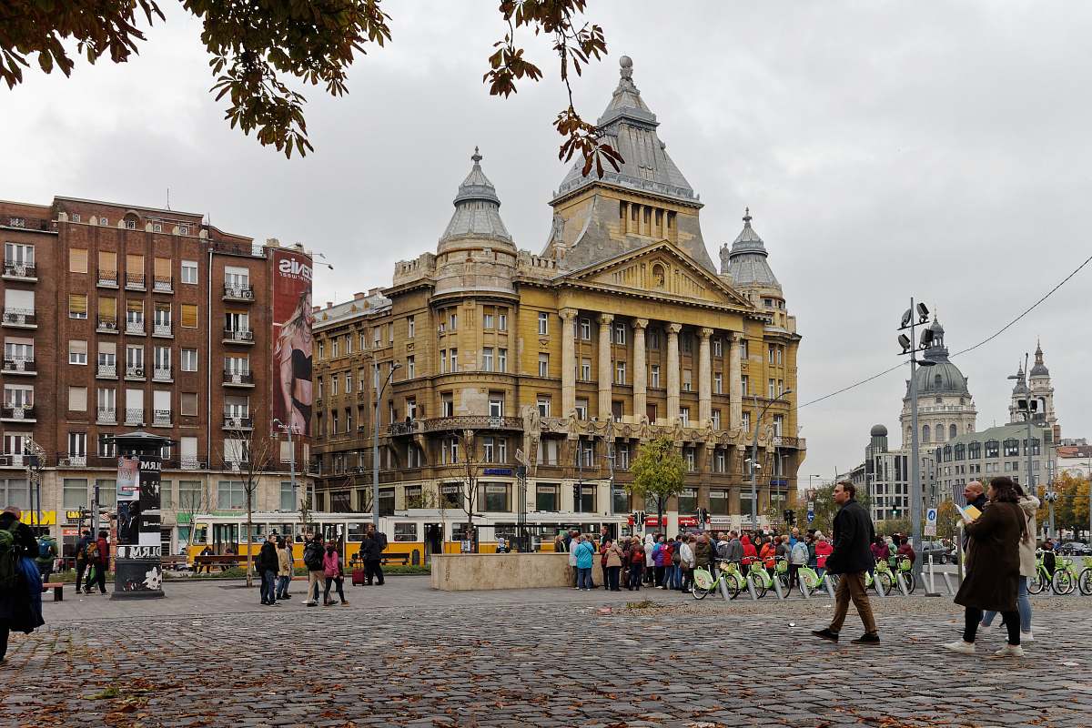 city crowd walking in front of concrete buildings during daytime downtown