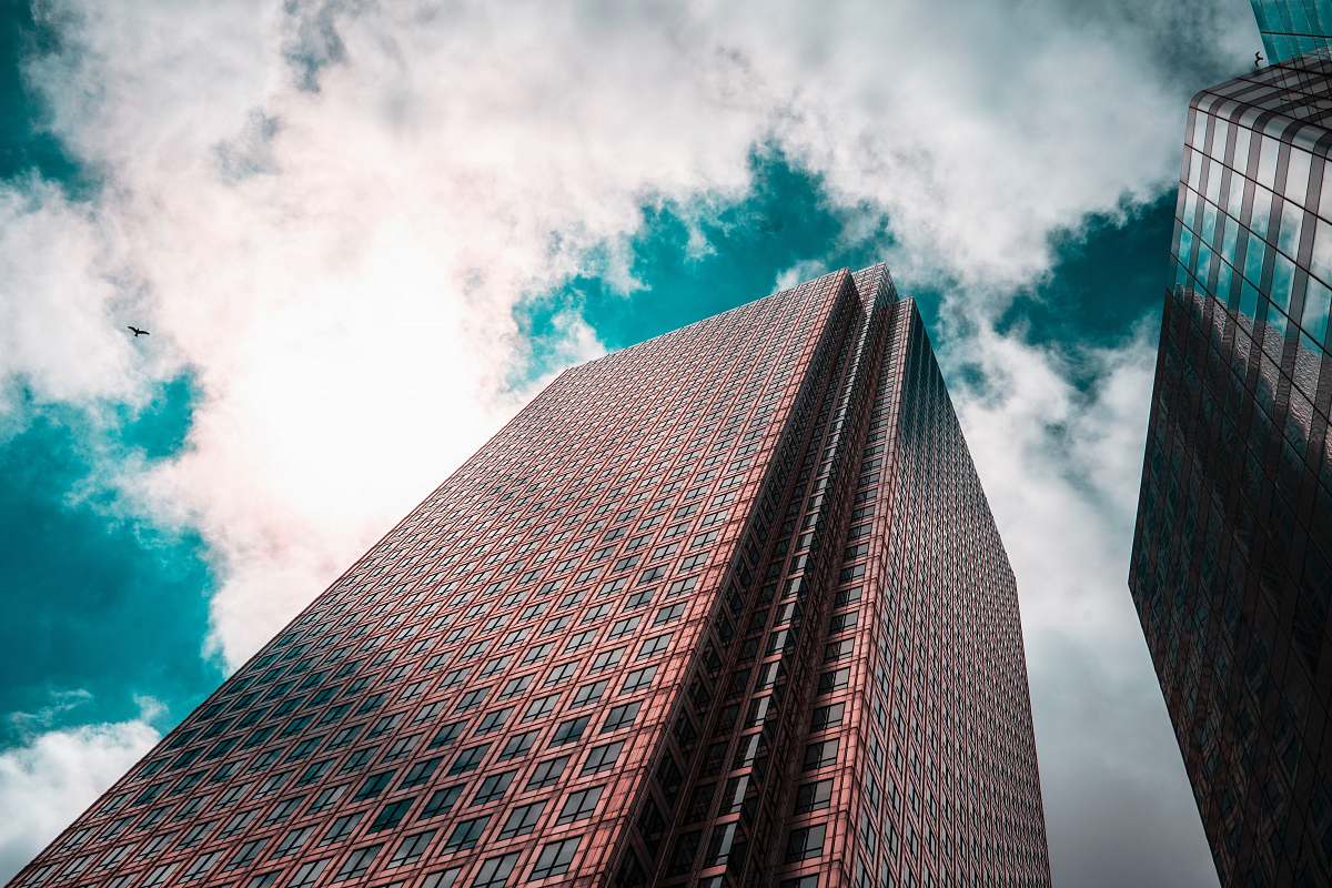 city curtain building under white clouds office building