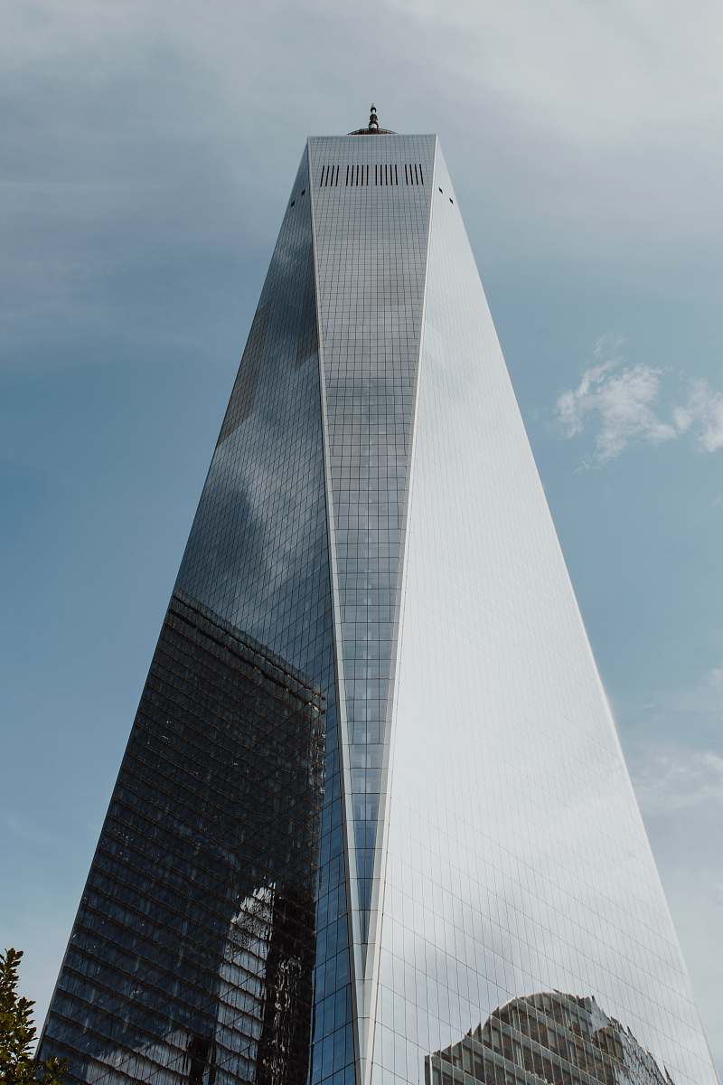city curtain wall building under blue sky high rise