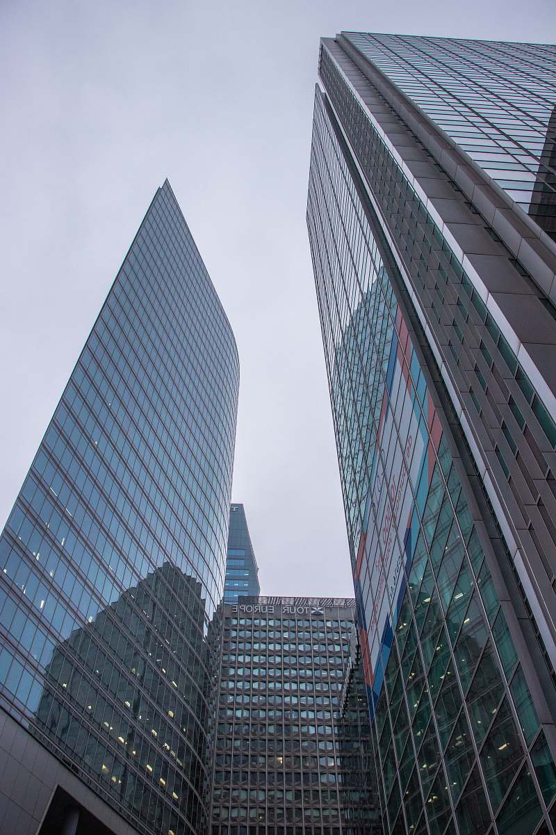 city curtain wall buildings under white sky office building